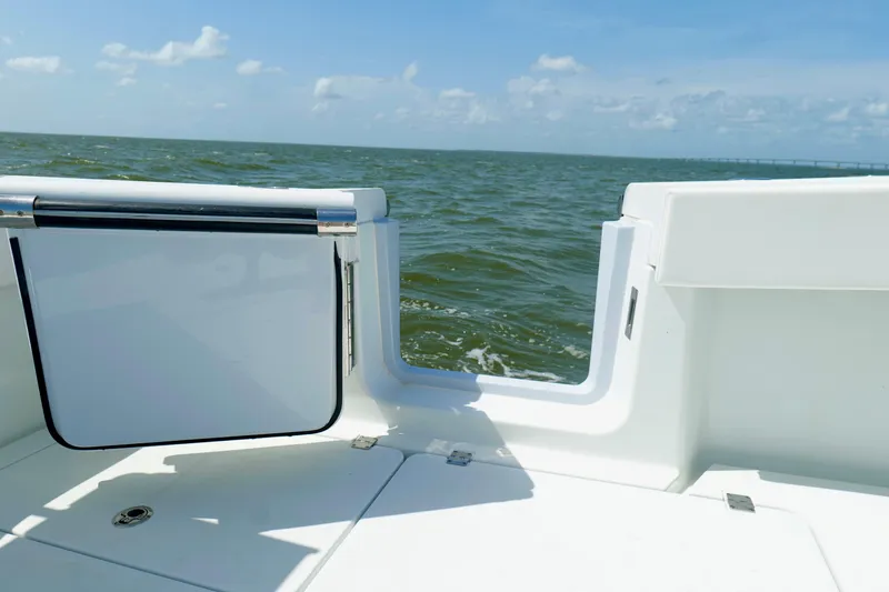 Slide: The Image of 2024 Freeman 38 boat deck with open transom door, overlooking the ocean. - 30