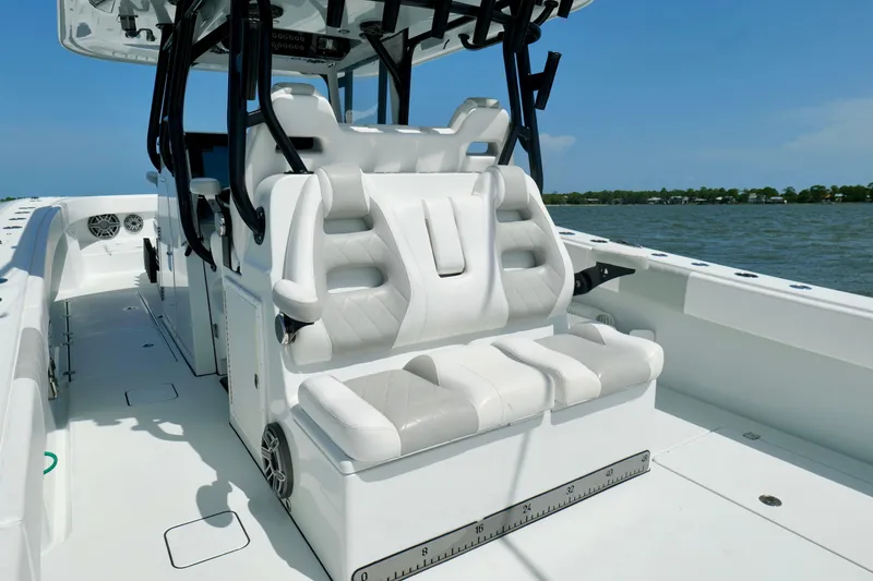 Slide: The Image of 2024 Freeman 38 boat interior with luxurious seating on a sunny day. - 26