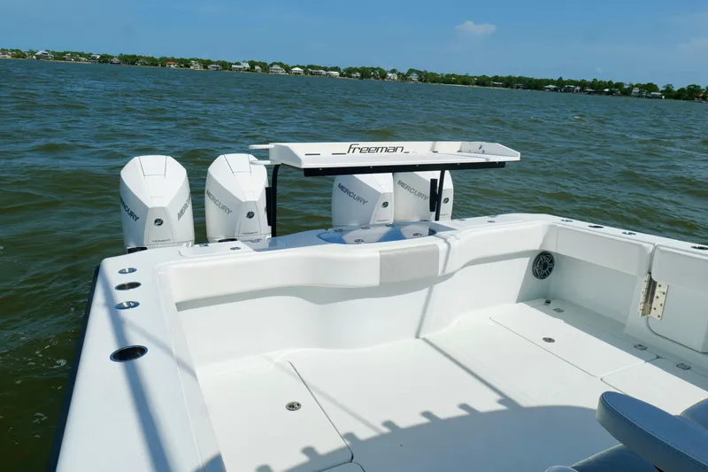 Slide: The Image of 2024 Freeman 38 boat with Mercury engines on a calm lake. - 18