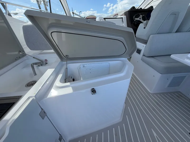 Slide: The Image of The 2027 Azimut A45 features a modern interior with gray upholstery and a built-in refrigerator. - 30
