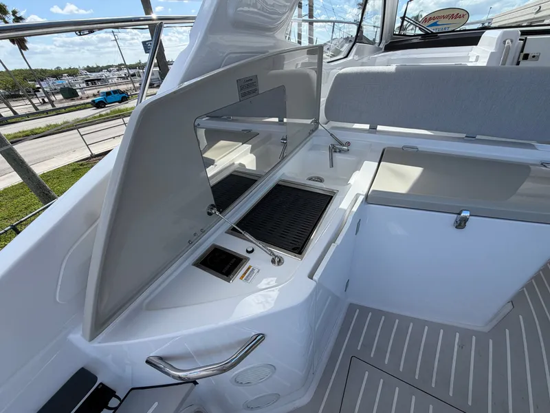 Slide: The Image of The 2027 Azimut A45 features a modern outdoor kitchen with a grill and sink. - 28