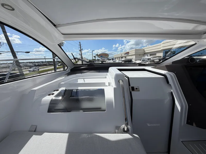 Slide: The Image of Interior view of a modern yacht with panoramic windows and sleek white surfaces. - 33