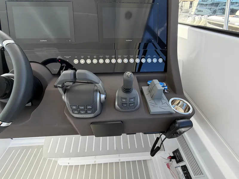 Slide: The Image of The image shows the helm of a 2027 Azimut A45 with modern controls and screens. - 43