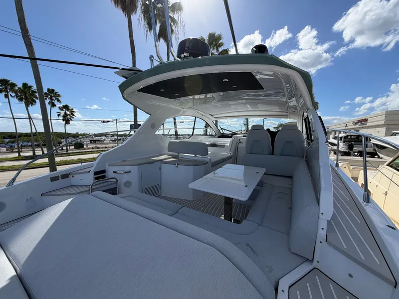 Slide: The Image of The image shows the deck of a 2027 Azimut A45 with sleek gray upholstery and a table. - 19