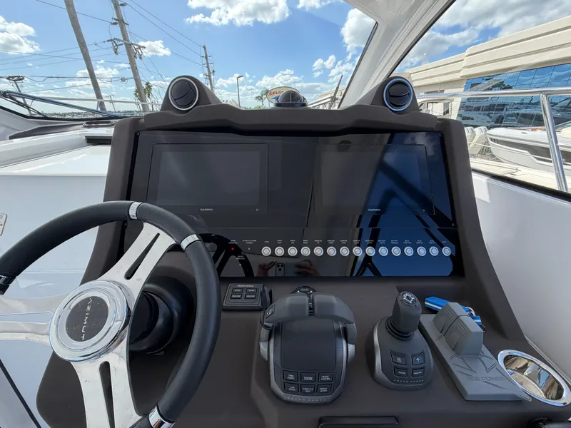 Slide: The Image of The image shows the helm of a 2027 Azimut A45 with modern controls. - 42