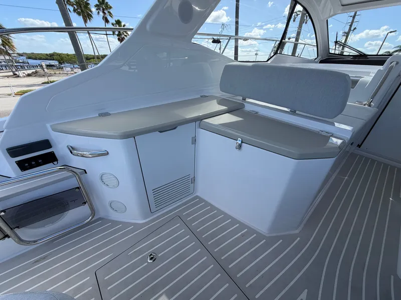 Slide: The Image of The image shows the cockpit of a 2027 Azimut A45 with gray seating and storage space. - 26