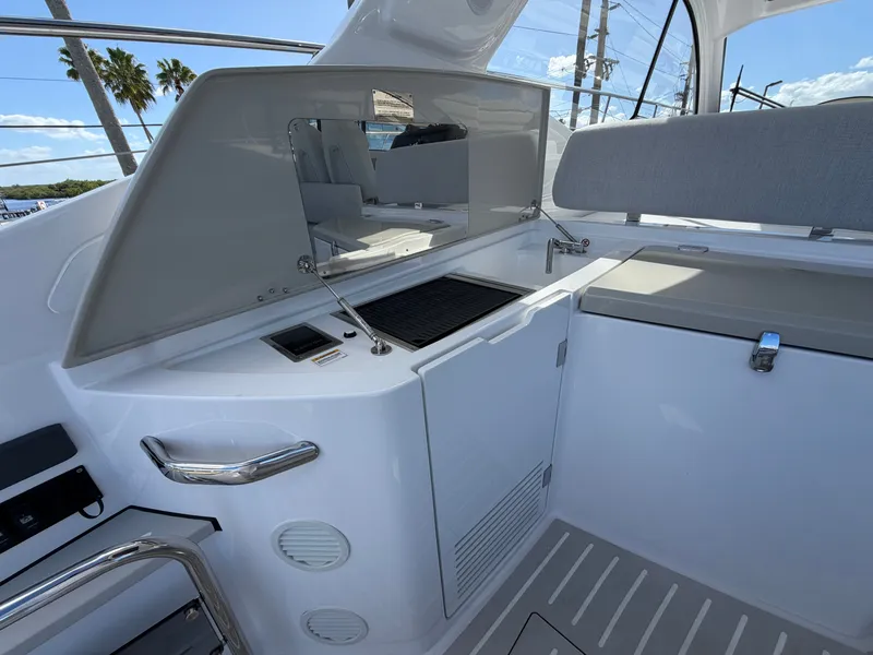 Slide: The Image of The 2027 Azimut A45 features a modern outdoor kitchen with a grill and storage space. - 29