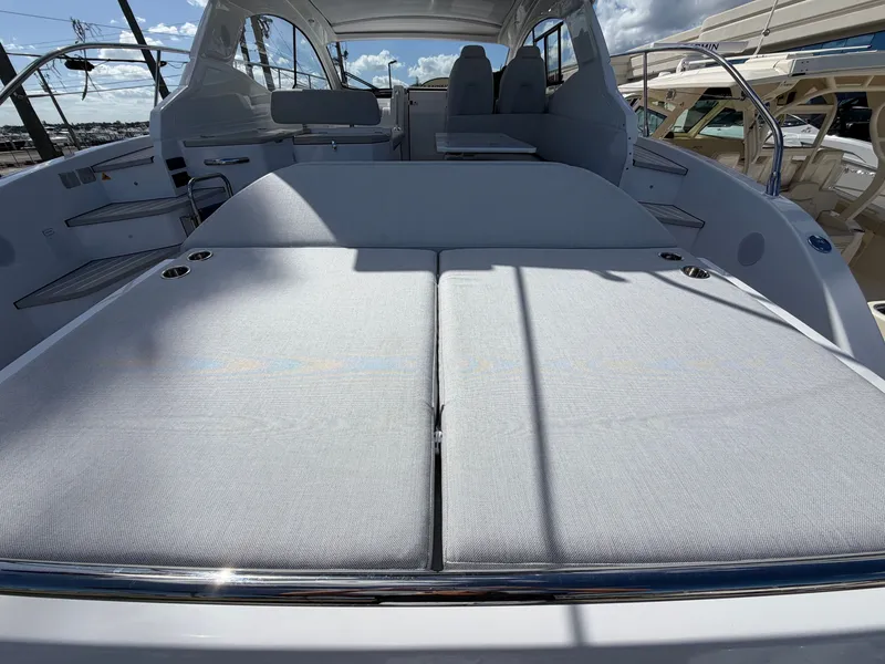 Slide: The Image of The image shows the spacious sun deck of a 2027 Azimut A45 at the marina. - 17