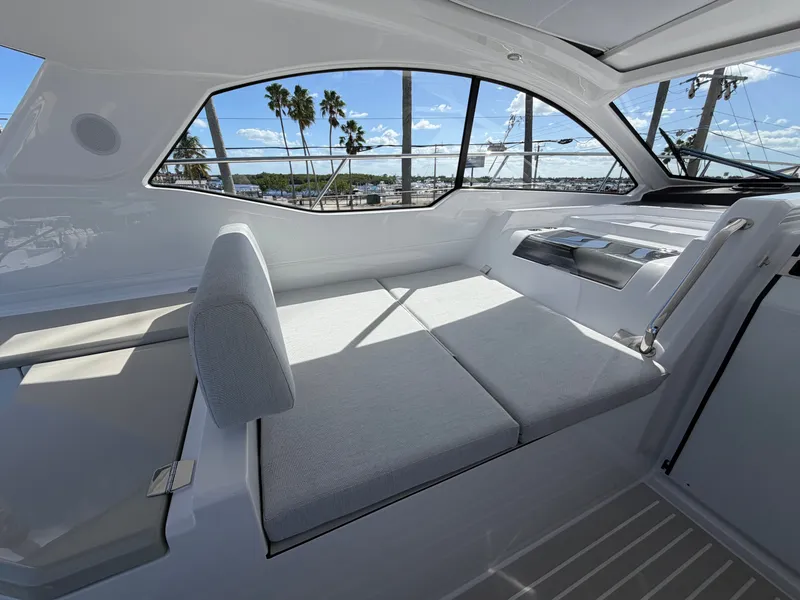 Slide: The Image of Interior of a 2027 Azimut A45 with sleek gray upholstery and large windows. - 32
