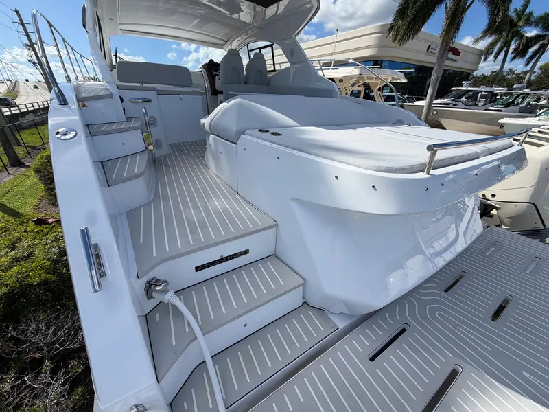 Slide: The Image of The 2027 Azimut A45 features sleek, modern design with white upholstery and teak decking. - 14