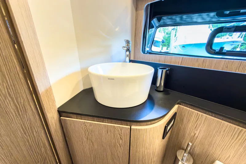 Slide: The Image of The image shows a modern bathroom on an Azimut A45 yacht, year 2027, featuring a stylish sink. - 30