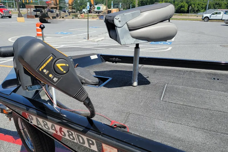 Slide: The Image of 2015 Crestliner VT 18 boat with trolling motor and swivel seat in parking lot. - 8
