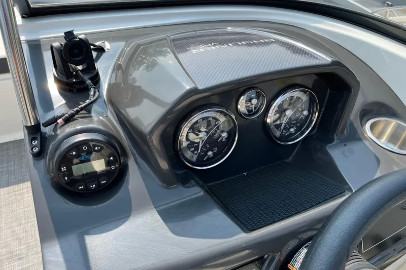 Slide: The Image of Dashboard of 2022 Bayliner VR5 Bowrider I/O with gauges and controls. - 8