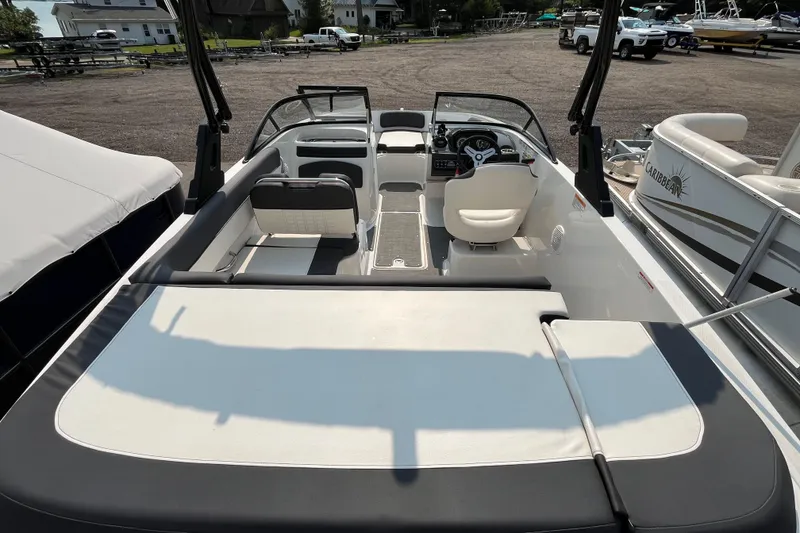 Slide: The Image of 2022 Bayliner VR5 Bowrider I/O boat interior with seating and steering wheel. - 4