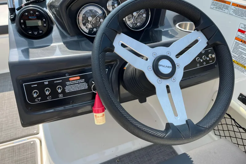 Slide: The Image of Steering wheel and dashboard of 2022 Bayliner VR5 Bowrider I/O boat. - 9
