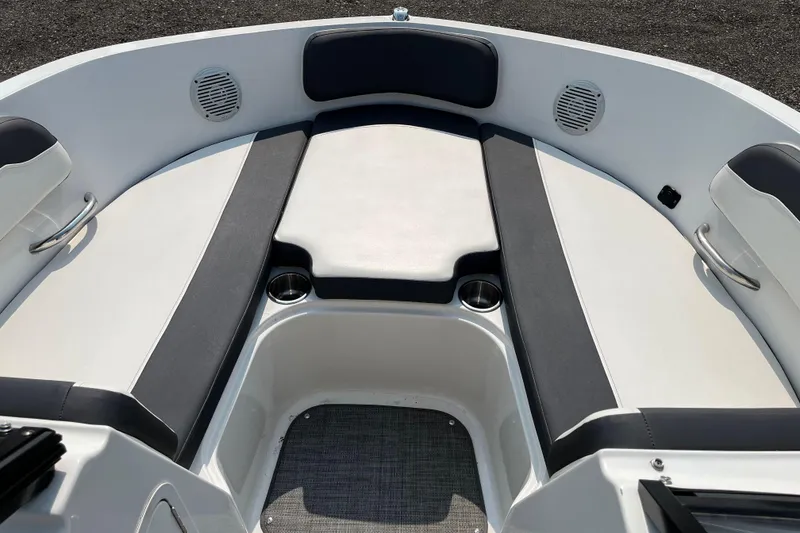 Slide: The Image of 2022 Bayliner VR5 Bowrider I/O interior with cushioned seating and cup holders. - 11