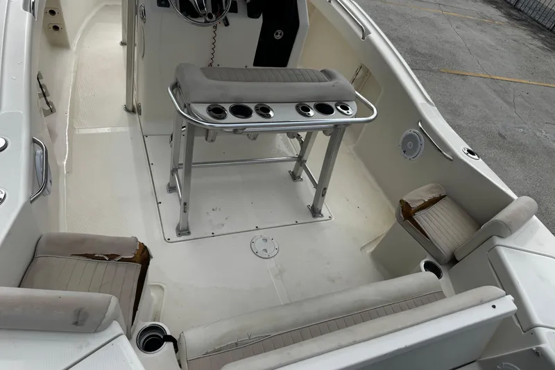 Slide: The Image of 2006 Scout 222 Sportfish boat interior with seating and console. - 14