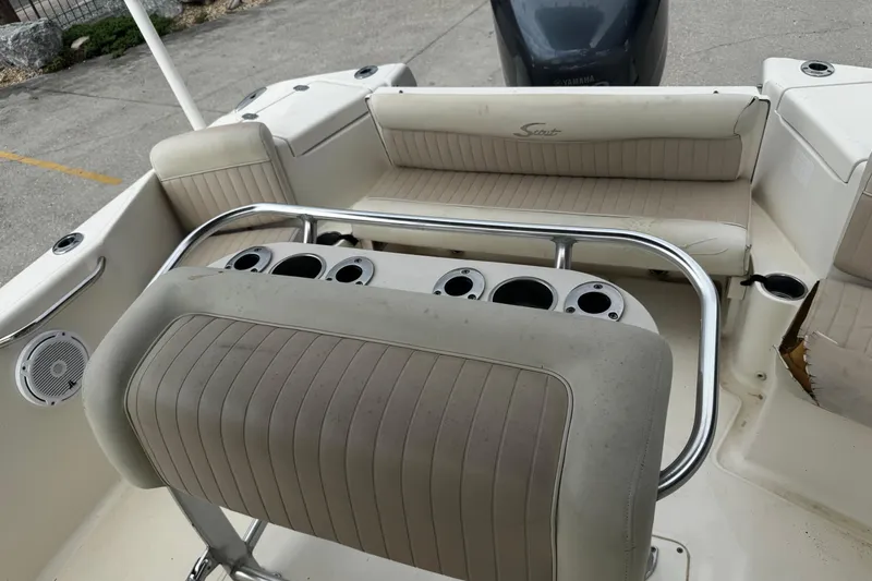 Slide: The Image of 2006 Scout 222 Sportfish boat interior with seating and rod holders. - 15