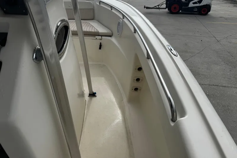 Slide: The Image of 2006 Scout 222 Sportfish boat interior with seating and stainless steel railings. - 13