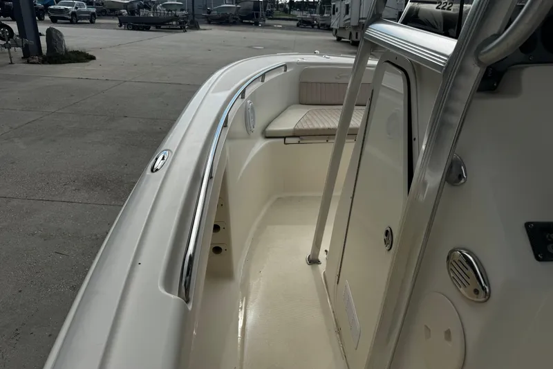 Slide: The Image of 2006 Scout 222 Sportfish boat interior with seating and stainless steel railings. - 17