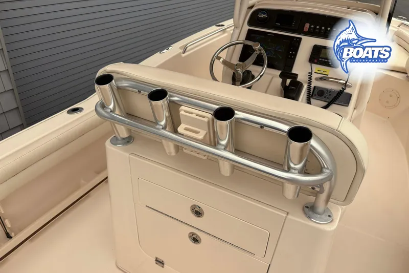 Slide: The Image of 2018 Grady-White Fisherman 216 boat console with rod holders and steering wheel. - 8