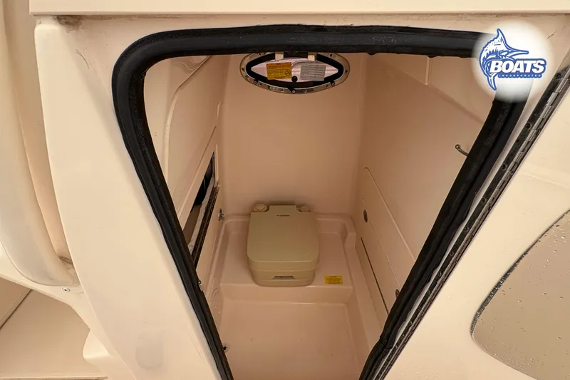 Slide: The Image of 2018 Grady-White Fisherman 216 boat interior with compact marine toilet. - 11