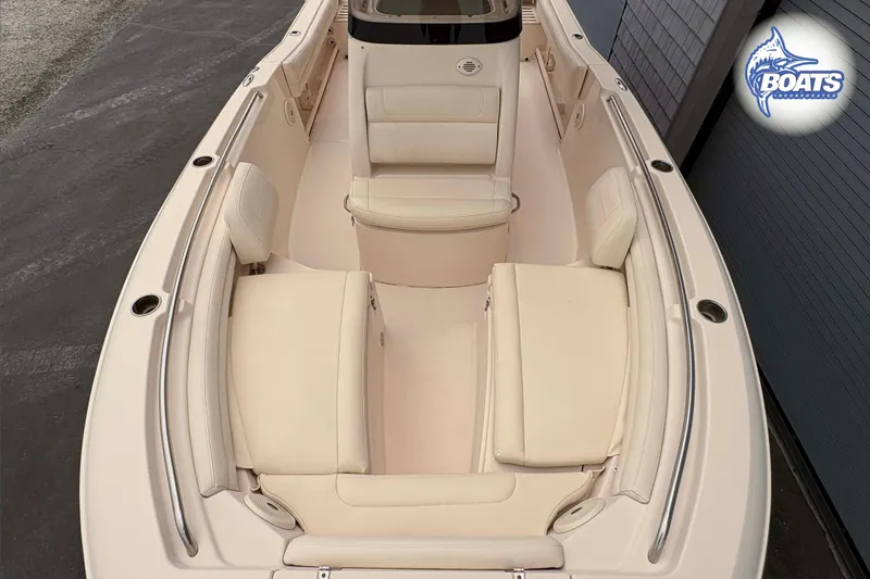 Slide: The Image of 2018 Grady-White Fisherman 216 boat interior with beige seating and sleek design. - 2