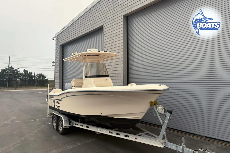 Slide: The Image of 2018 Grady-White Fisherman 216 boat on trailer outside a building with Boats Incorporated logo. - 1