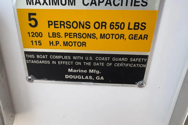 Slide: The Image of Capacity label for Clearwater 1900 Center Console, 2011; max 5 persons or 650 lbs. - 4