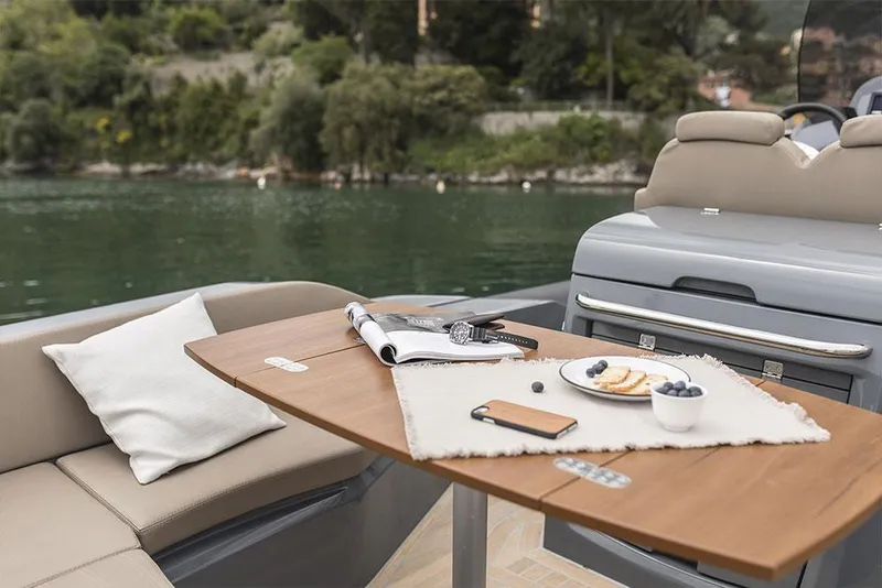 Slide: The Image of Manufacturer Provided Image: Luxury dining setup on a 2022 SACS Strider 900 boat with scenic water view. - 32