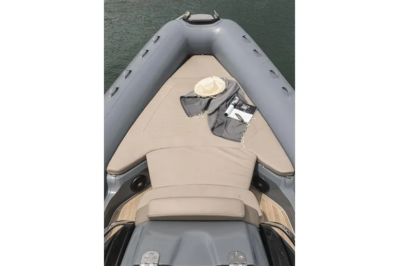 Slide: The Image of Manufacturer Provided Image: 2022 SACS Strider 900 boat with sunbathing area, hat, and towel. - 31