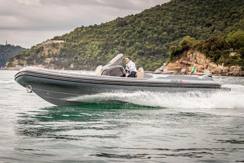 Slide: The Image of Manufacturer Provided Image: 2022 SACS Strider 900 cruising on water near a lush, hilly coastline. - 25