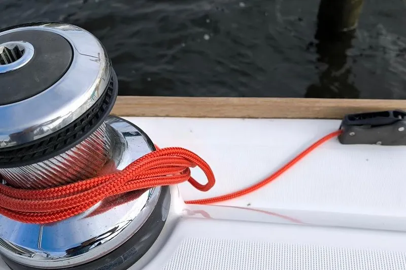 Slide: The Image of Winch with red rope on 2011 Beneteau Oceanis 40 sailboat deck. - 23