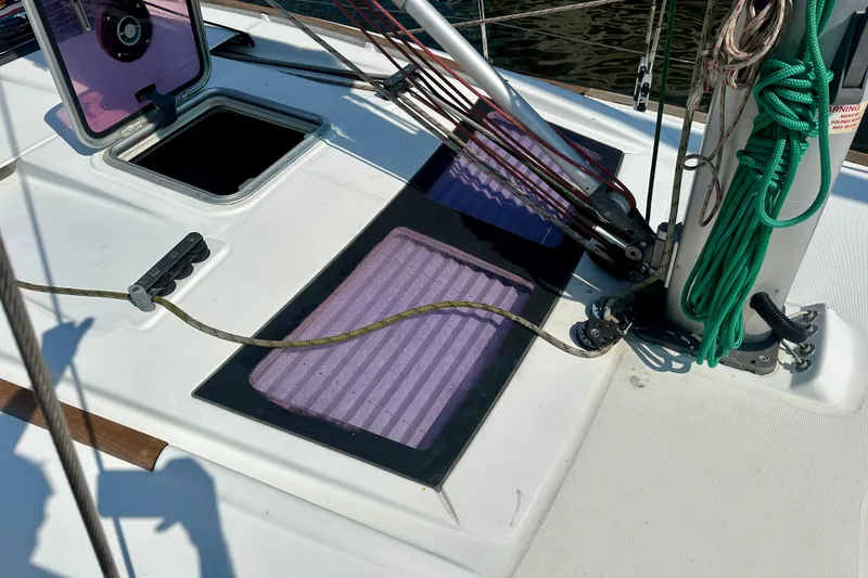 Slide: The Image of Deck of 2010 Beneteau Oceanis 40 sailboat with open hatch and rigging details. - 29