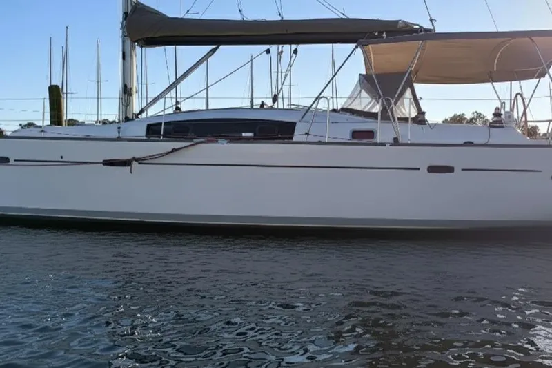 Slide: The Image of 2011 Beneteau Oceanis 40 sailboat on calm water, side view. - 3