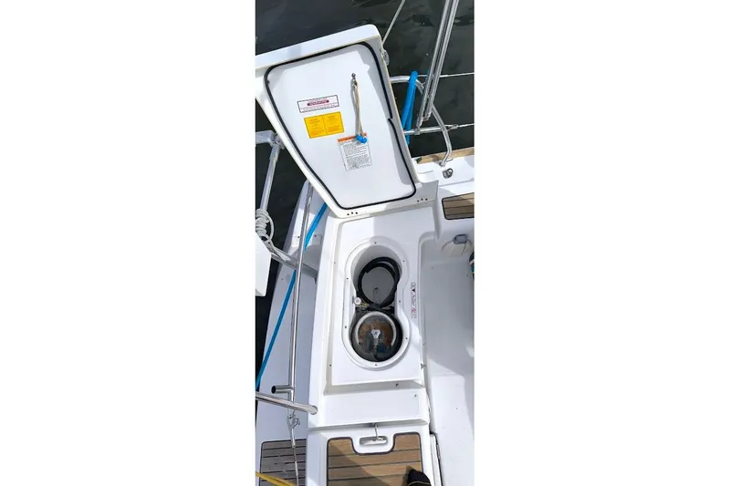 Slide: The Image of Open hatch on 2011 Beneteau Oceanis 40 sailboat, showing storage compartment. - 31