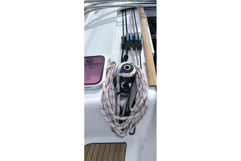 Slide: The Image of Deck of 2011 Beneteau Oceanis 40 sailboat with coiled rope and winch. - 22