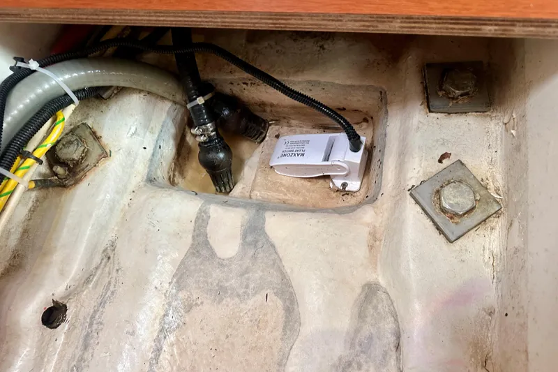 Slide: The Image of Bilge area of 2010 Beneteau Oceanis 40 sailboat with hoses and wiring. - 56