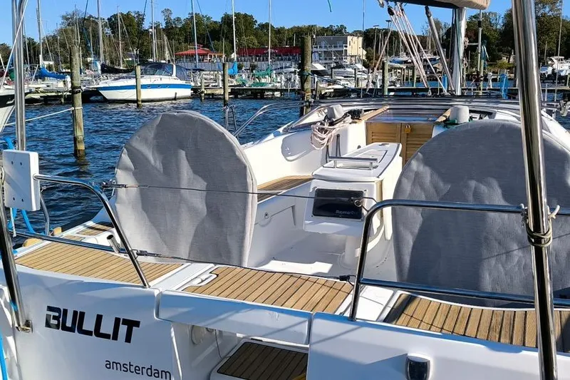 Slide: The Image of 2011 Beneteau Oceanis 40 sailboat docked in a marina, rear view. - 5