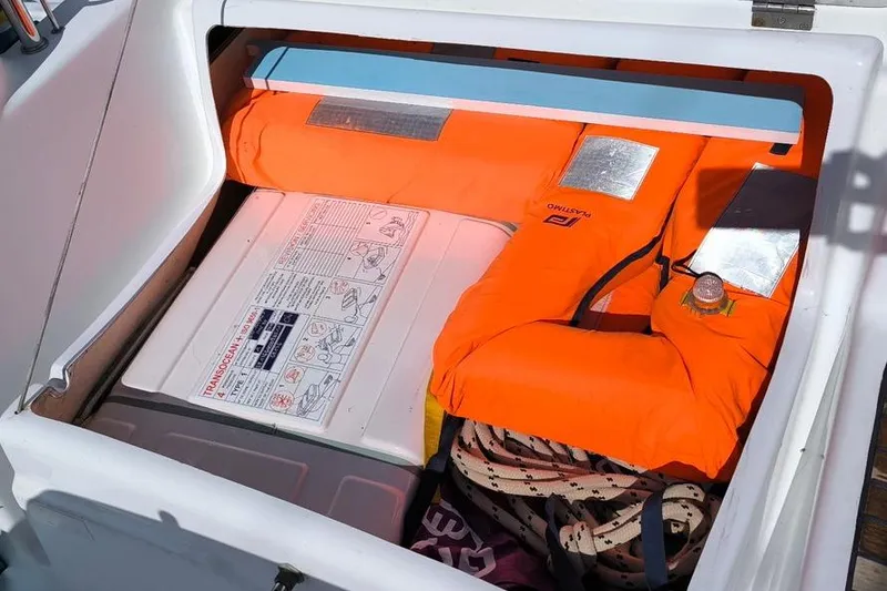 Slide: The Image of Storage compartment on a 2011 Beneteau Oceanis 40 with life jacket and safety equipment. - 35