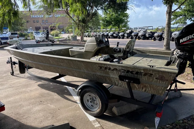 Slide: The Image of 2014 Tracker Grizzly 1754 SC boat on trailer at Tracker Boat Center. - 3