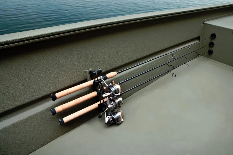 Slide: The Image of Three fishing rods are neatly secured on the side of a Tracker Grizzly 1754 SC boat. - 20