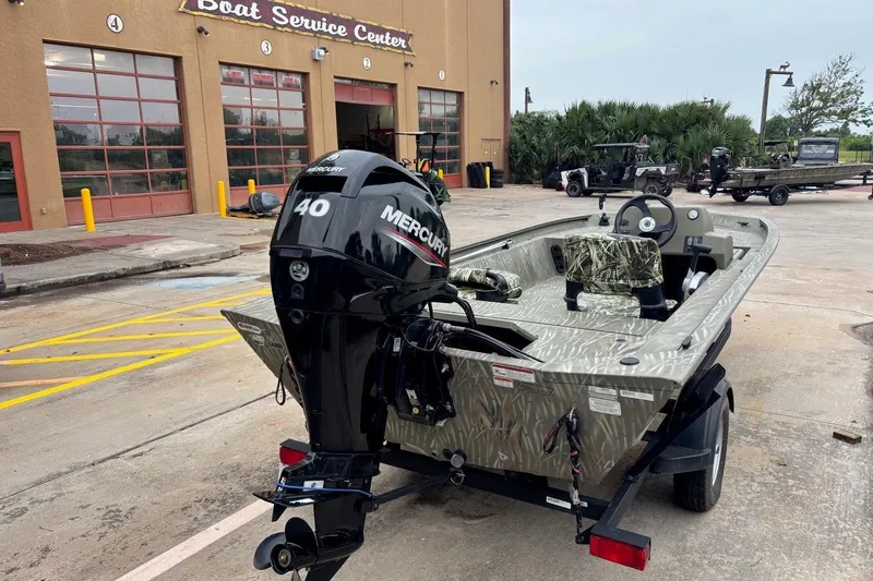 Slide: The Image of 2014 Tracker Grizzly 1754 SC boat with Mercury 40 engine at service center. - 8