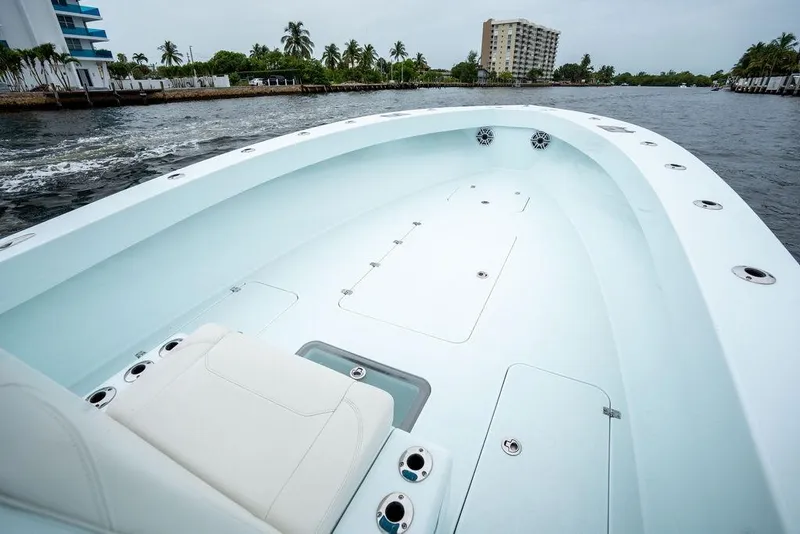 Slide: The Image of 2019 Conch 33 boat interior with sleek design on a calm waterway. - 15