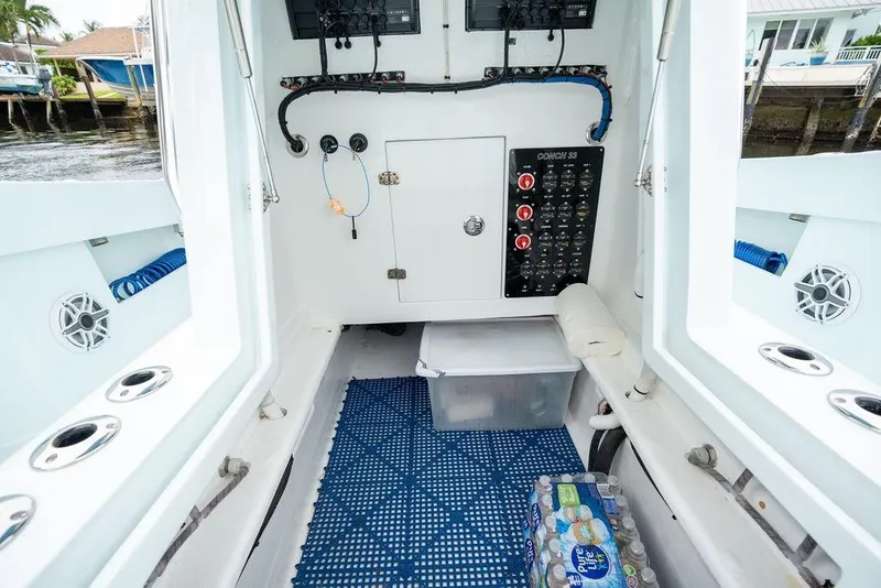 Slide: The Image of Interior of a 2019 Conch 33 boat featuring control panel and storage area. - 22