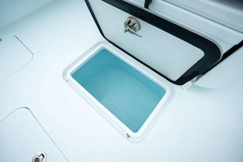 Slide: The Image of Open storage compartment on 2019 Conch 33 boat deck. - 35