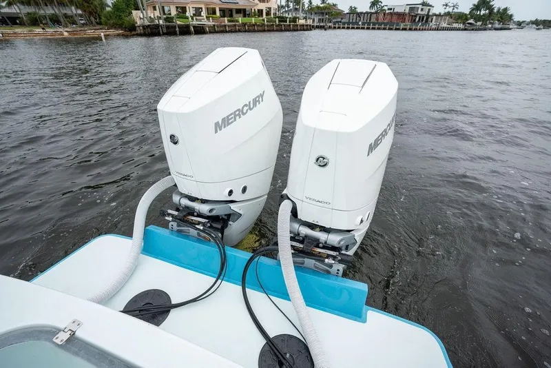 Slide: The Image of Twin Mercury Verado engines on a 2019 Conch 33 boat, docked by the water. - 40