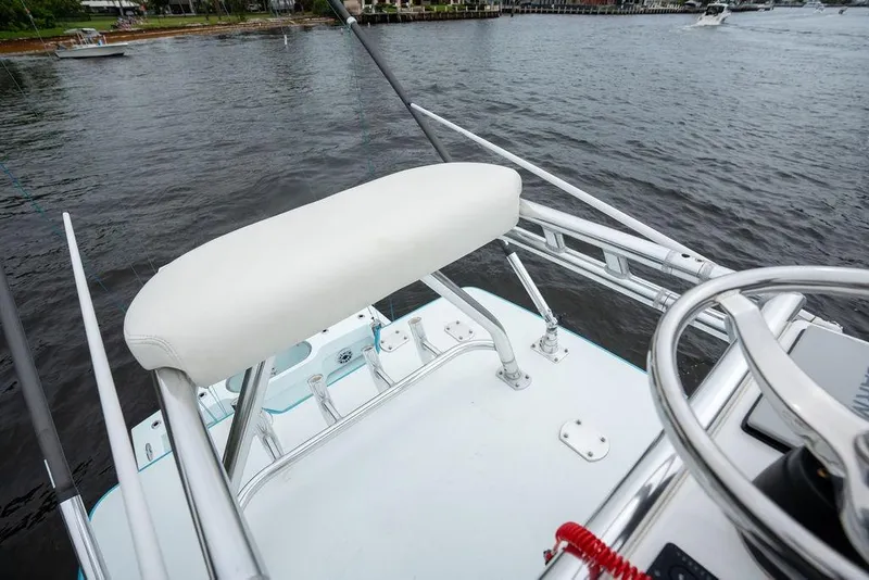 Slide: The Image of Helm seat on 2019 Conch 33 boat overlooking calm waters. - 31