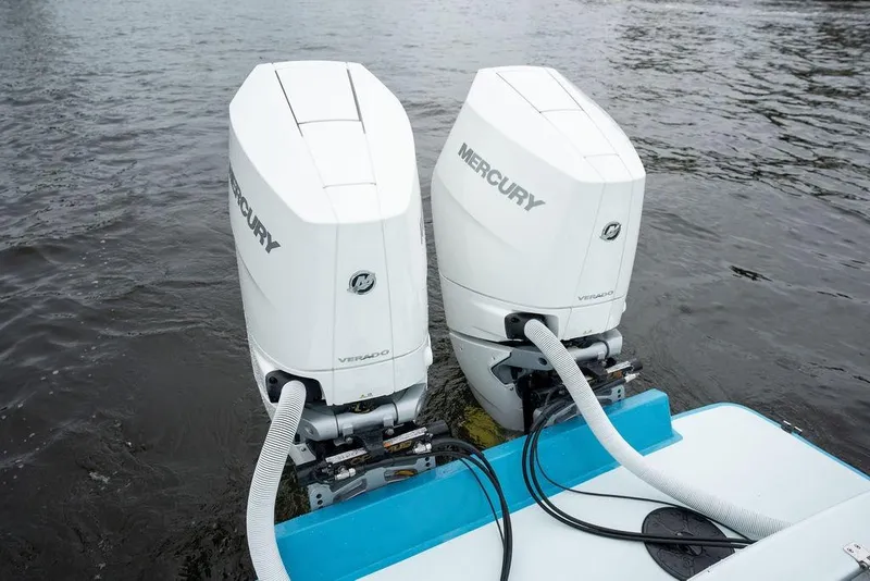 Slide: The Image of Twin Mercury Verado outboard engines on a 2019 Conch 33 boat in water. - 41