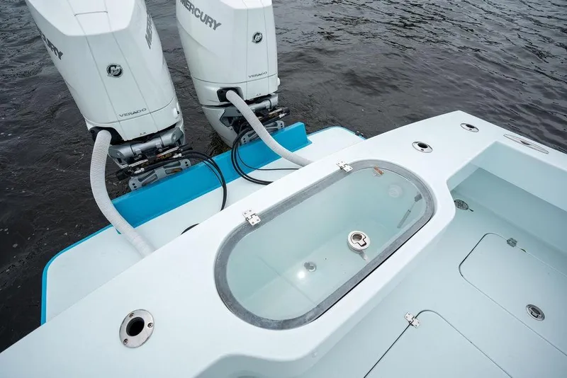 Slide: The Image of 2019 Conch 33 boat with dual Mercury Verado engines and a livewell on deck. - 39